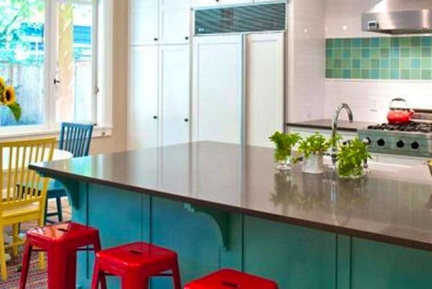 
A youthful combination of seating colours adds zing to this updated kitchen. 
