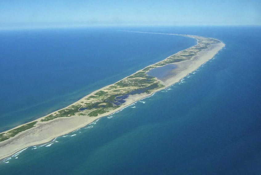 
This aerial photo of Sable Island shows the mysterious land that drew Bill Barton to explore the history and search for remains of residents of past generations. - Parks Canada
