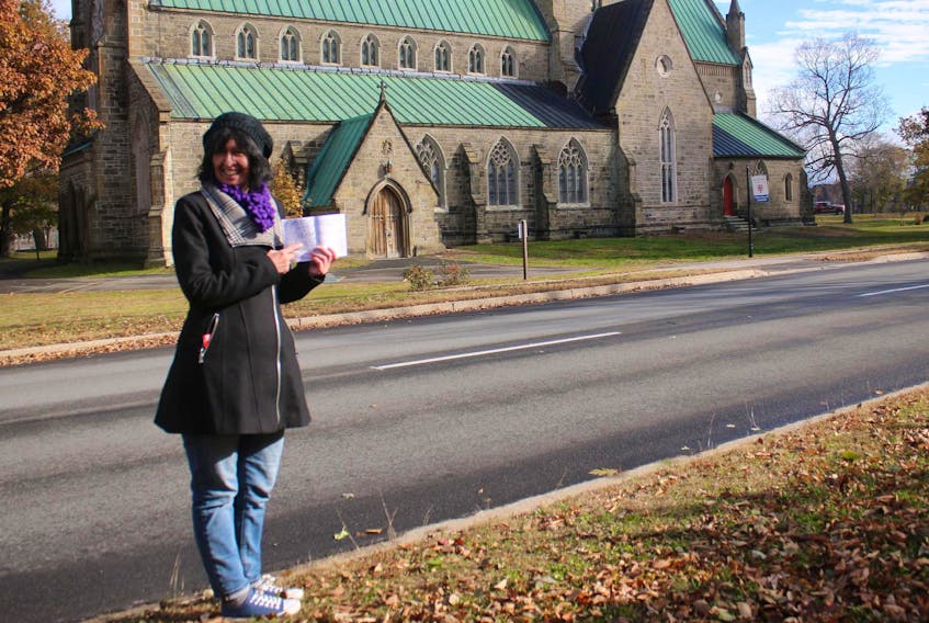 Koral LaVorgna pauses for a moment on her walking tour to share some fascinating information about Fredericton's historic places and characters.