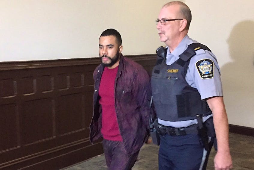 Tyrell Peter Dechamp is led into Halifax provincial court in December 2017 to face two charges of first-degree murder. - Steve Bruce