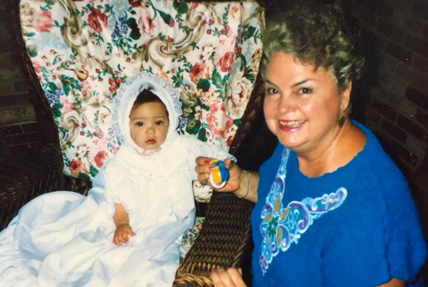 
A homemaker and mother of six with a creative streak, Dorothy Cummings had a special knack for sewing. Pictured here with her granddaughter Cassie Doucette, Cassie is wearing the christening gown Cummings made for her. - Contributed
