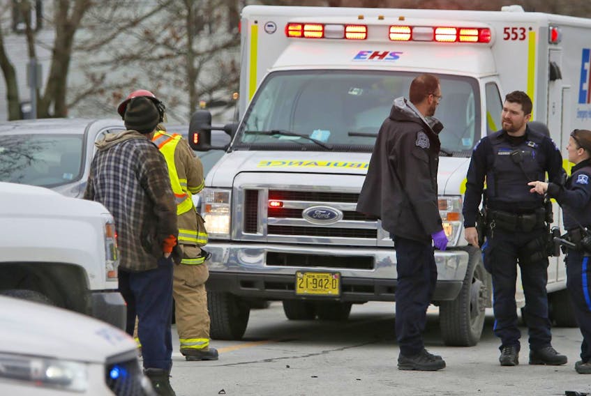 
Halifax Regional Policeoffficers confer after a truck struck a pedestrian at the intersection of Albro Lake and Victoria roads in Dartmouth on Tuesday, Jan. 8, 2019. - Tim Krochak / The Chronicle Herald
