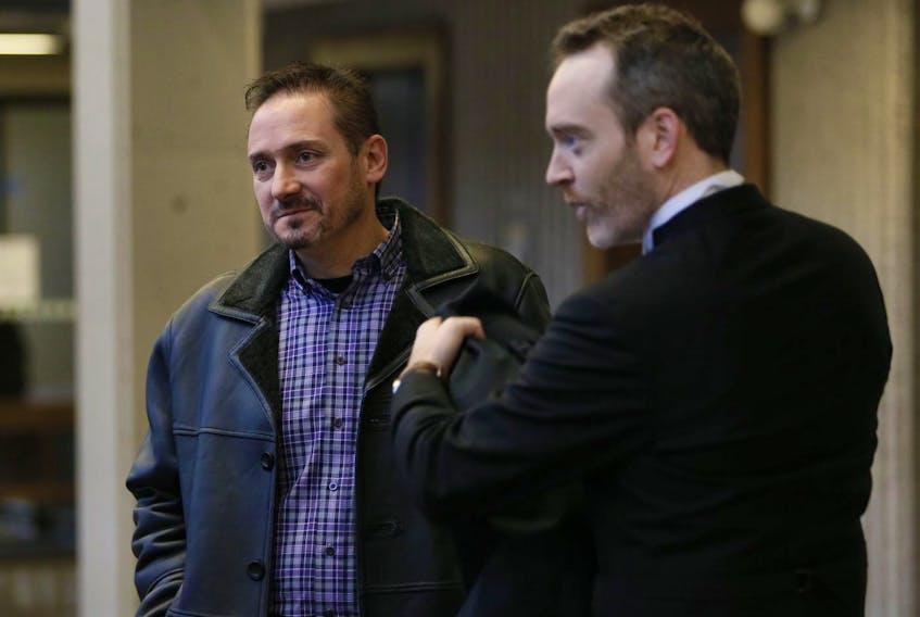 
Elie Phillip Hoyeck speaks with his lawyer, Trevor McGuigan, before entering Nova Scotia Supreme Court in Halifax on Friday. Hoyeck was found not guilty of criminal negligence causing death in connection with a 2013 explosion at his former auto shop that killed a mechanic. - Tim Krochak
