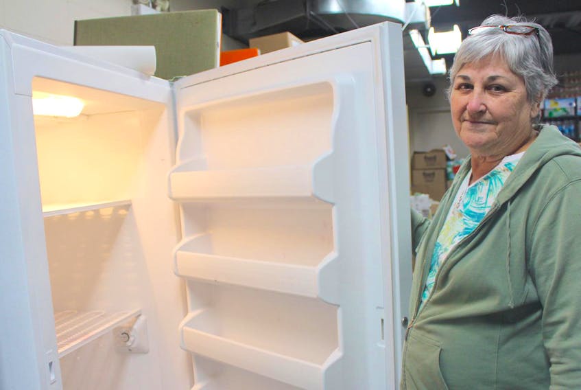 
Cindy Loan, Matthew 25 Windsor and District Food Bank’s co-ordinator, is seen here. The cupboards, fridges and freezers at the food bank were either empty or almost empty after the centre’s first day open this year. 
