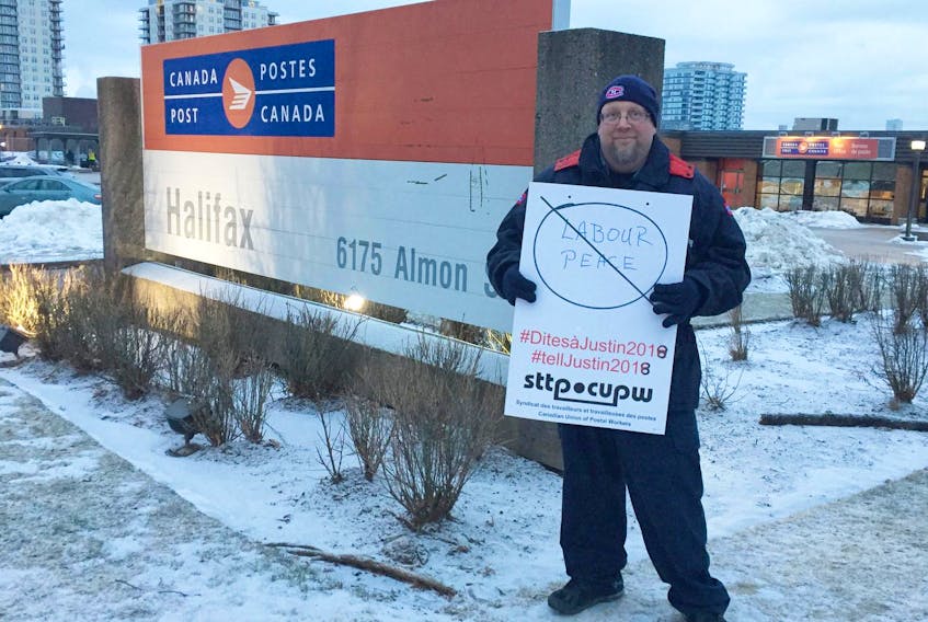 
Mike Keefe, first vice-president of the Nova Local of the Canadian Union of Postal Workers, pickets in front of the Halifax Metro Processing Plant on Almon Street on Wednesday, the first day of arbitration under back-to-work legislation. - Nicole Munro
