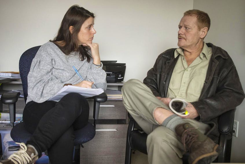 
Tara Kinch, a community support worker at Chebucto Connections, talks with client Steven Falshaw on Jan. 24. 
