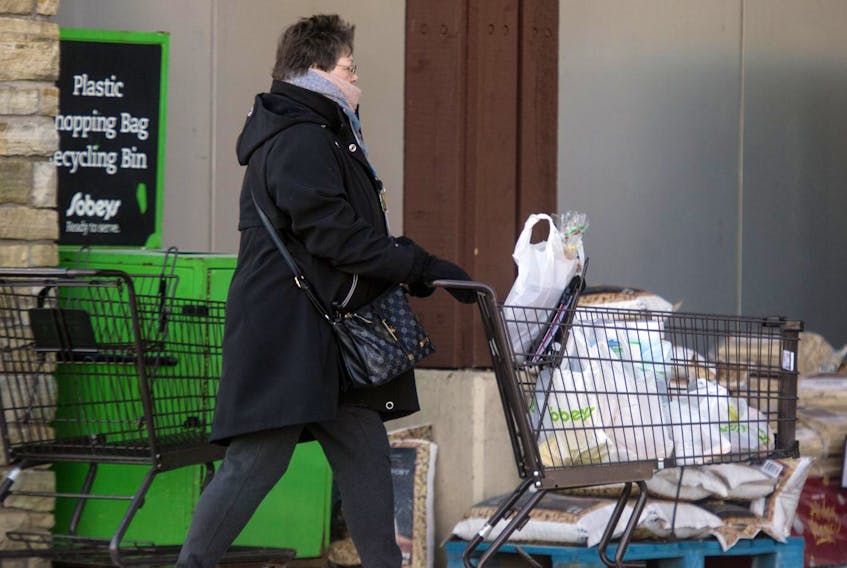 
A shopper heads out of the Mumford Road Sobeys on Thursday. - Ryan Taplin
