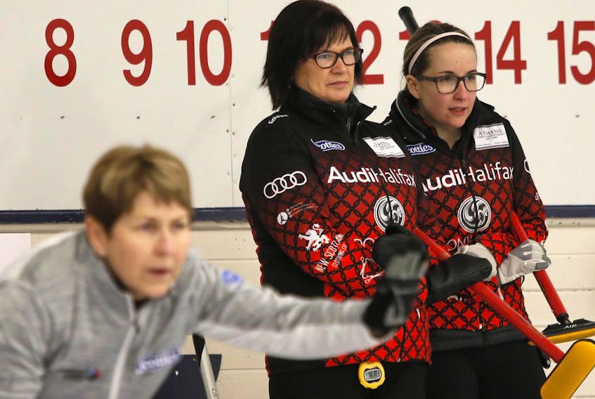 
Dartmouth skip Mary-Anne Arsenault, centre and third Christina Black, right, discuss strategy at last year’s Scotties Tournament of Hearts at the Dartmouth Curling Club. - Tim Krochak
