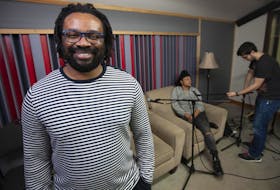 
Filmmaker Israel Ekanem in a studio at the Centre For Art Tapes in Halifax as he prepares to do a podcast with local artist Kate Macdonald. 
