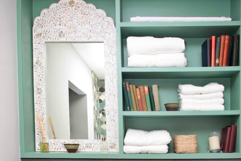 
Most available wall space in a typical bath is already taken up by items like the sink, vanity, mirror and shower/tub. But that zone atop the potty can be ideal for a cabinet, rack or shelf — providing more room in which to stow your stuff. - Getty Images/iStockphoto


