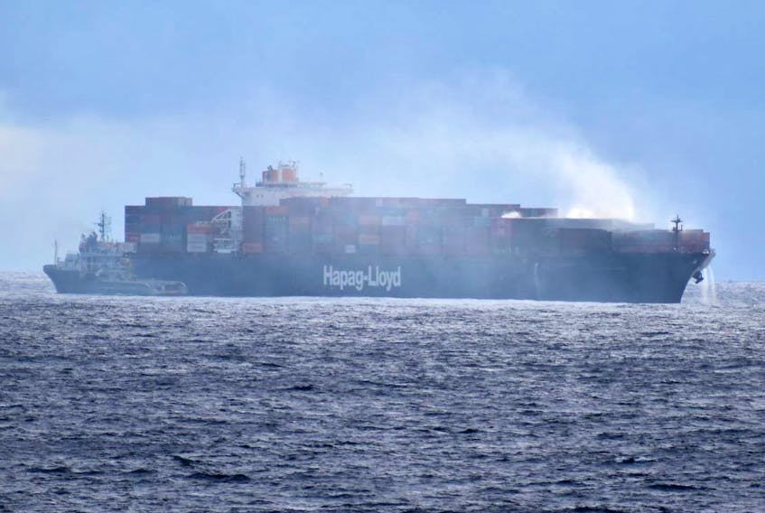 
The M/V Yantian Express is seen on Jan. 15. The ship's cargo is still on fire and smoke and water can be seen coming from the ship. - Cameron Brunick 
