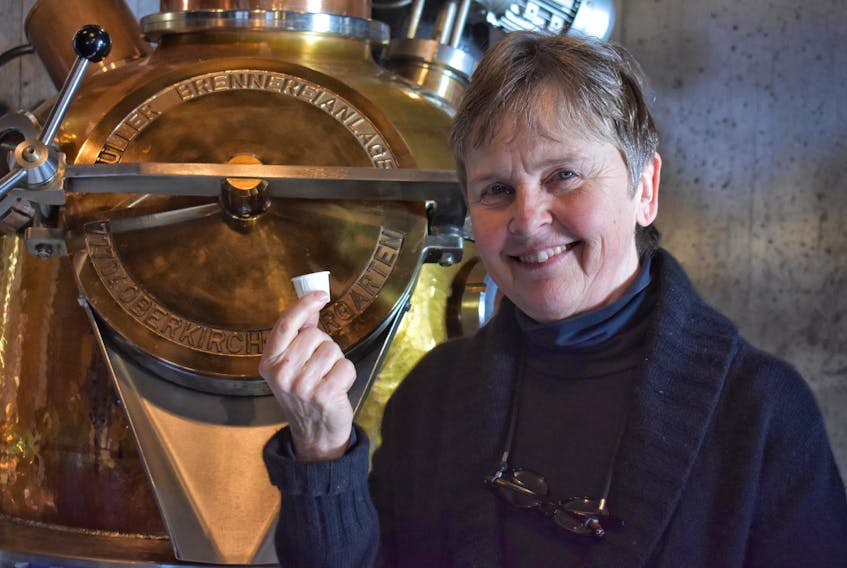 
Ironworks Distillery owner Lynne MacKay shows off her ‘ugly cup,’ just one of the initiatives the business has taken to become plastic free. 
