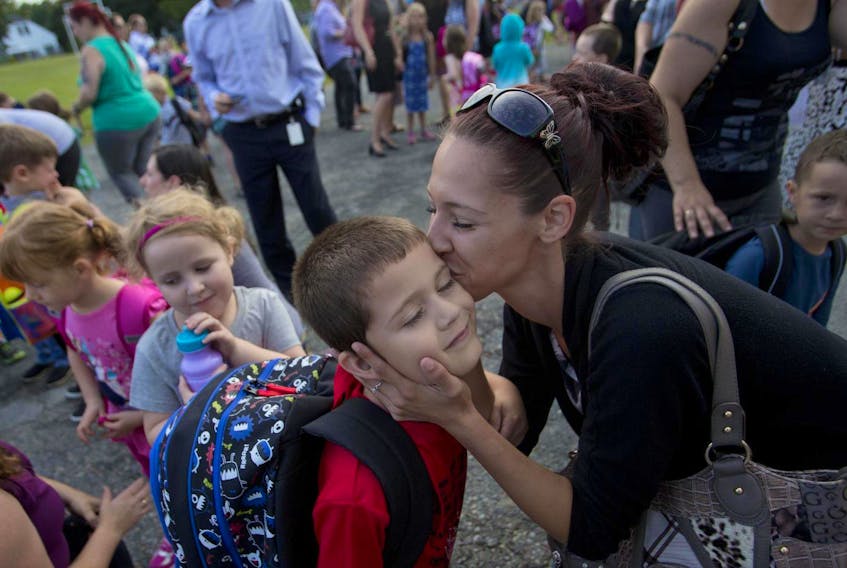 
Lindsay Verge, kisses her son Bradley, 5, while he stands in line for his first day of school at St. Stephen's Elementary in Halifax in 2015. - Tim Krochak
