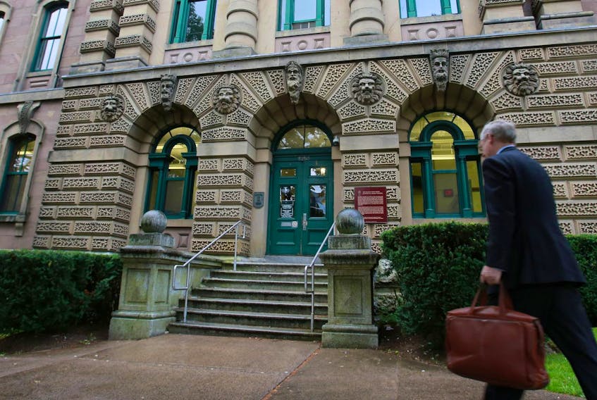 
A lawyer walks into the Halifax provincial courthouse located on Spring Garden Rd. in 2016. - The Chronicle Herald
