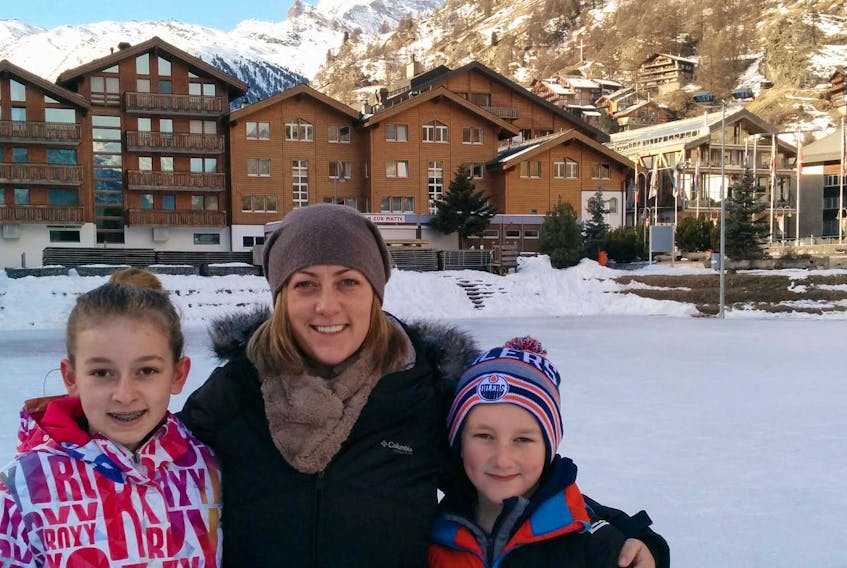 Nardine Kwasny and her children Jack and daughter Dylan pose for a photo in Zermatt, Switzerland, with the Matterhorn in the background.