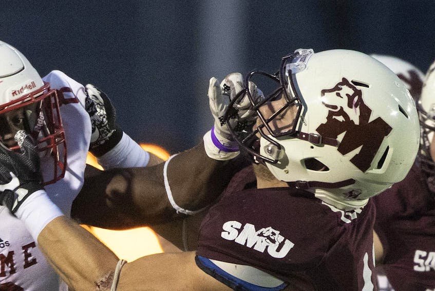 
A Saint Mary’s player unafiliated with the allegations againt the football squad’s coaches battles through a facemask during 2018 regular seaon play. - Eric Wynne
