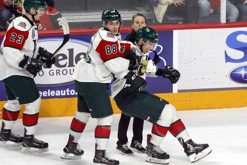 
Halifax Mooseheads captain Antoine Morand and athletic therapist Robin Hunter help defenceman Jared McIsaac off the ice after taking a check during a Jan. 13 QMJHL game at the Scotiabank Centre. McIsaac only missed limited time but several teammates haven’t been as fortunate. (ERIC WYNNE/Chronicle Herald)
