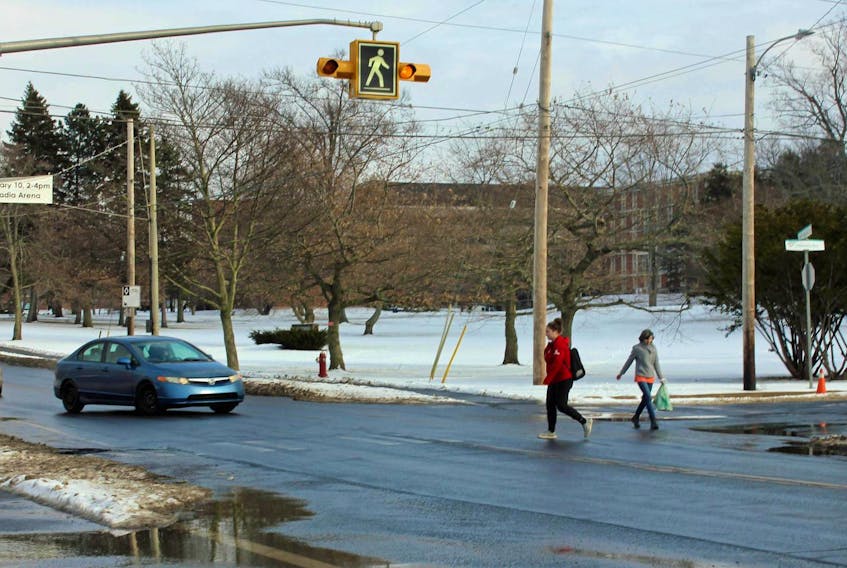 
While it was quiet Monday, a steady stream of students fill the crosswalk at the intersection of Main Street and University Avenue at peak times. - Ian Fairclough
