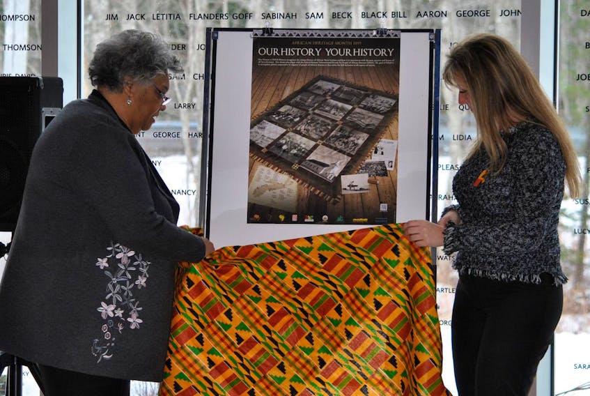 
Dr. Elizabeth Cromwell and Shelburne Municipal Warden Penney Smith unveil the poster for African Heritage Month at the Municipal Proclamation Launch on Feb. 4 at the Black Loyalist Heritage Centre in Birchtown. During the event Cromwell was also honoured for her investiture into the Order of Canada in November 2018. (Kathy Johnson)
