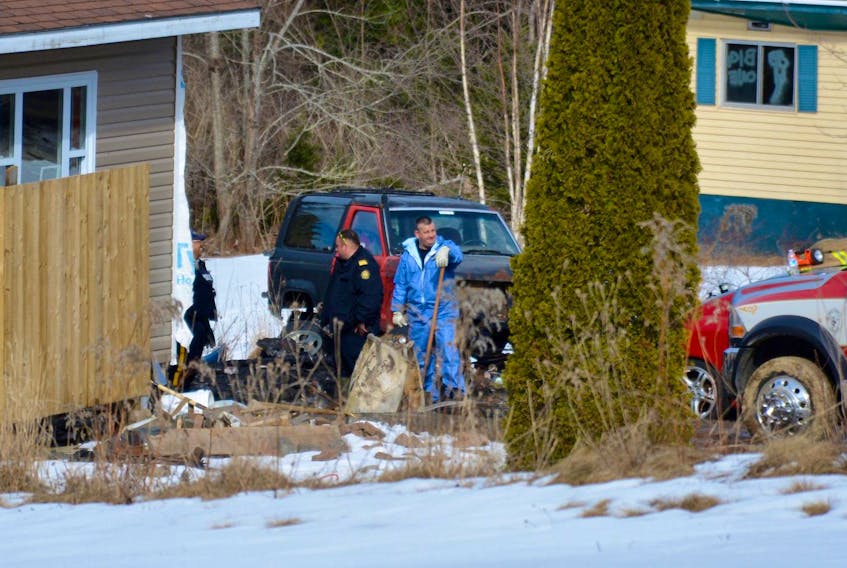 
Investigators are shown at the scene of a South Rawdon in this Apr 2017 file photo, where the remains of Laura Ross were found.
