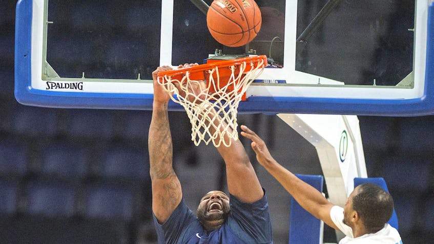 St. John’s Edge forward Glen (Big Baby) Davis misses a dunk as Halifax Hurricanes forwards Chadrack Lufile (left) and Mike Poole defend during the first half of an NBL Canada game Sunday afternoon at Scotiabank Centre. The Hurricanes pulled out a 104-98 victory, their fourth in a row. RYAN TAPLIN