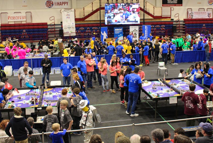 
Teams squared off in the 14th annual Robot Programming Competition at Acadia University on Saturday, Feb. 16. Team tables (from left): the SPEC Blazers from Sherwood Park Education Centre in Sydney, Kentville’s 21st Century Space Guys, Kingston’s the Sisters of Science and the Cooperatition Crew from Sydney. (Heather Desveaux)
