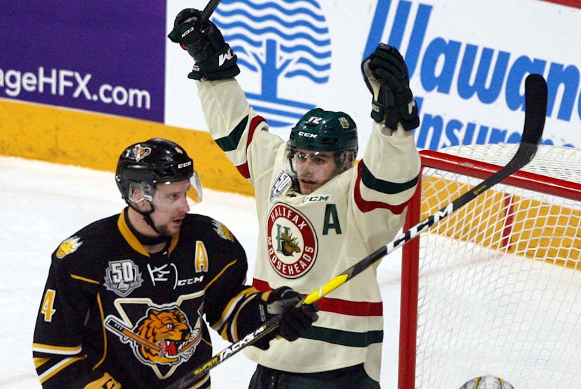 
Halifax Mooseheads forward Samuel Asselin, centre, celebrates a goal against the Victoriaville Tigres during a Jan. 31 game at the Scotiabank Centre. - Eric Wynne
