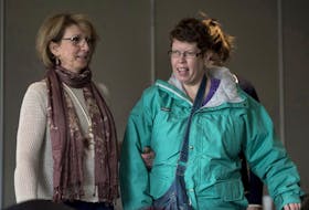 Beth MacLean, right, the woman at the centre of a human rights case dealing with persons with disabilities and their attempts to move out of institutions, and Jo-Anne Pushie, MacLean’s former social worker, arrive at an inquiry in Halifax last year.
