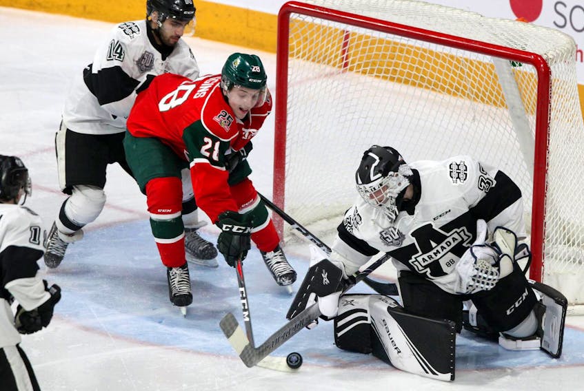 
Halfiax Mooseheads winger Ben Higgins battles for control of the puck against Blainville-Boisbriand Armada goalie Brendan Cregan during Sunday’s QMJHL game at the Scotiabank Centre. - Eric Wynne
