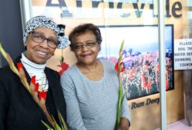 
 Bernice Arsenault, left, and Beatrice Wilkins, were among the former Africville residents who were in attendance for the unveiling of an installation at the Halifax Stanfield International Airport.  During the late 1960s, the City of Halifax condemned the area, forcing its residents out in order to develop the A. Murray MacKay Bridge and Fairview Cove. - ERIC WYNNE 
