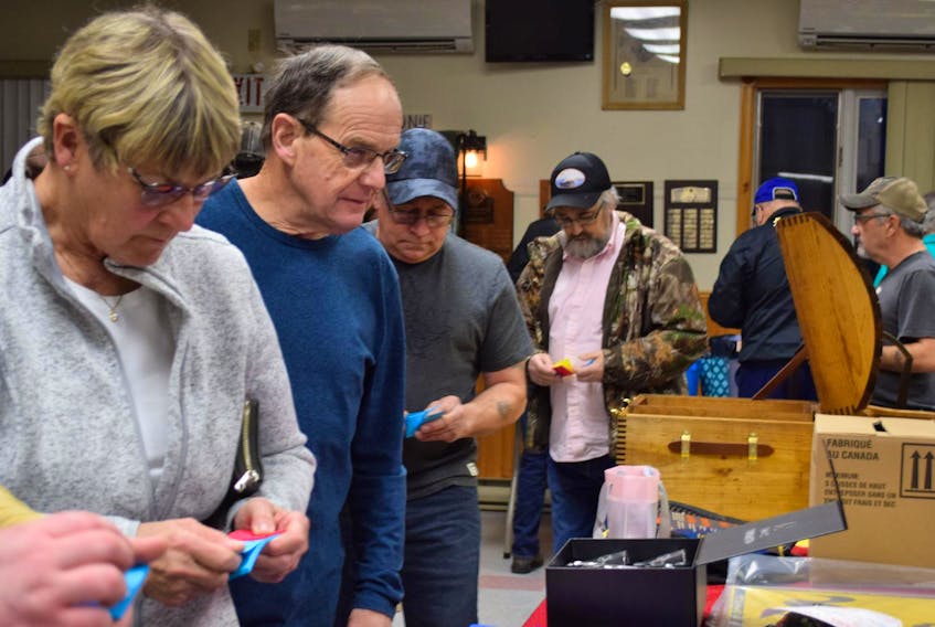 
People look over the prizes up for grabs in one of the raffle draws at the Shelburne County Ducks Unlimited (DU) lobster dinner and auction on Feb.23 at the Barrington and Area Lions Hall.
