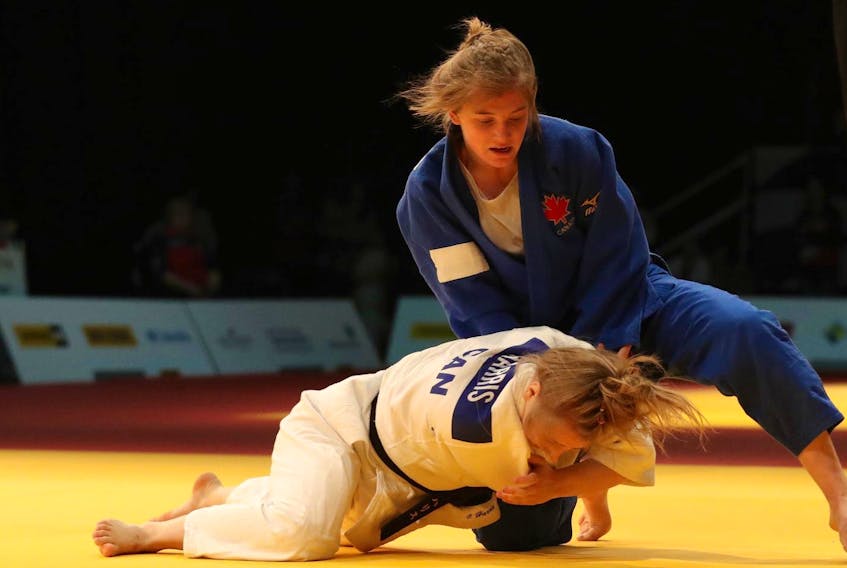 
Halifax’s Sierra Tanner, top, competes against Isabelle Harris of British Columbia in the 63-kilogram division in the judo competition at the Canada Winter Games on Wednesday in Red Deer, Alta. Harris won the gold medal. - Fran Harris
