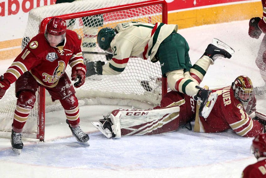 
Halifax Mooseheads’ Patrick Kyte trips over Bathurst Titan goaltender Mark Grametbauer late in the first period of a QMJHL game at the Scotiabank Centre on Wednesday. - Eric Wynne
