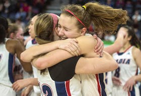 
Acadia Axewomen’s Jayda Veinot, right, celebrates with Claire Ayotte after their 84-74 victory over the Memorial Sea-Hawks in the AUS women’s basketball championship at the Scotiabank Centre on Sunday. - Ryan Taplin
