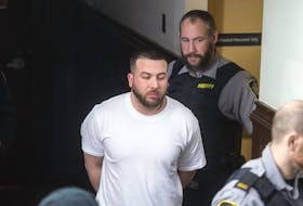 
Adam Joseph Drake is escorted into Halifax provincial court Thursday to face a charge of first-degree murder in the November 2016 shooting death of Tyler Keizer. - Ryan Taplin

