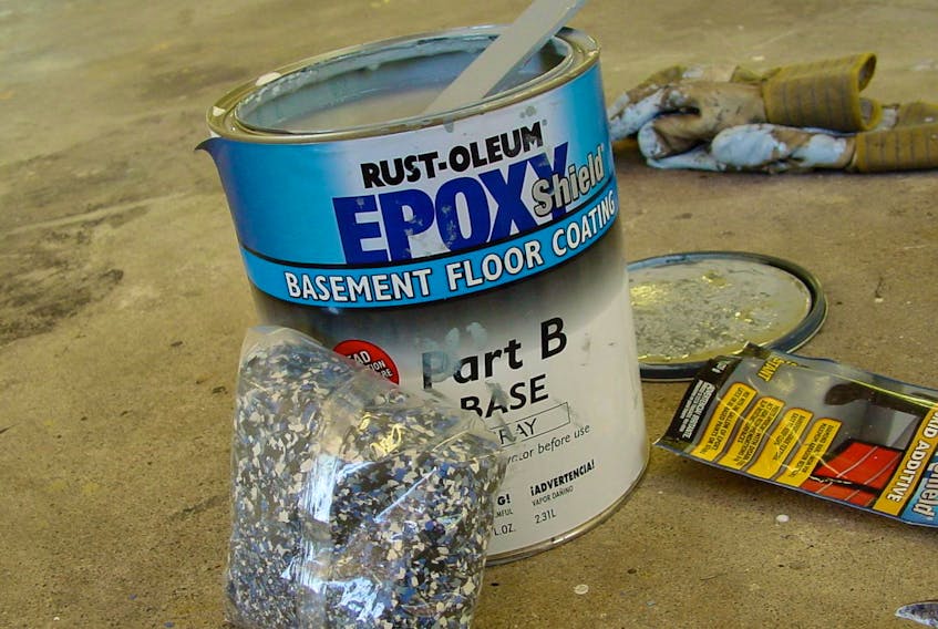 
Epoxy floor coatings harden by chemical reaction and provide better durability than paint. Flecks of plastic spread on the surface when the epoxy is wet provide a better appearance for the finished floor. 
