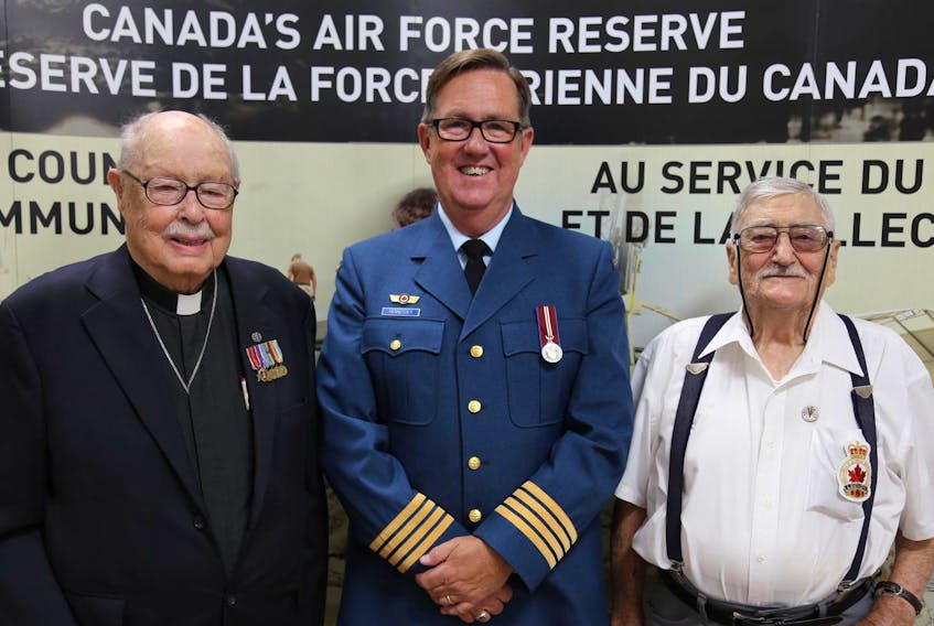 
Honorary Colonel Dan Hennessey is flanked by Second World War veterans Rev. Ron Mosley (left) and Pierre Allaine. Hennessey's Time to Remember video, a compilation of poignant interviews with 18 Lunenburg County veterans, will be screened at Government House in Halifax on March 26. 
