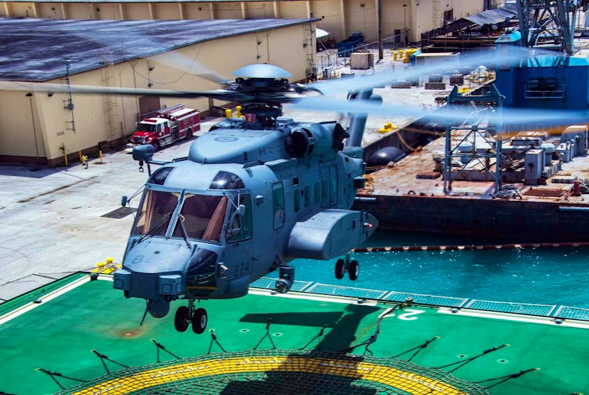 Members of HMCS Regina’s air detachment fly Bronco, the CH-148 Cyclone helicopter, from the NRU Asterix to a land base for maintenance during Operation Projection Asia Pacific at Naval Base Guam, U.S., March 5, 2019. - Cpl. Stuart Evans