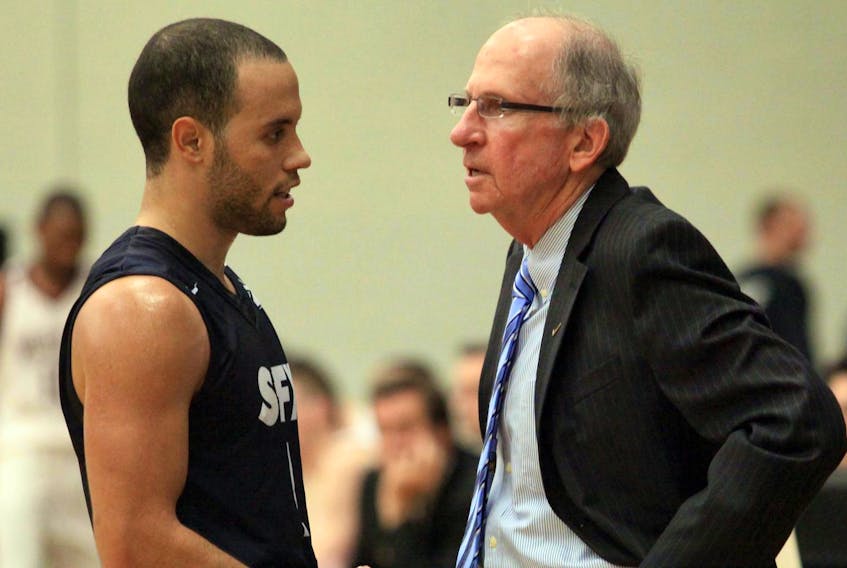 
Former St. Francis Xavier basketball player Tyrell Vernon, left, will work with the university’s men’s and women’s team as an associate coach, with the plan to succeed X-Men head coach Steve Konchalski, right, following the 2020-21 AUS season.

November 29, 2011--St. FX coach Steve Konchalski talks to Tyrell Vernon during a game against Saint Mary's on Tuesday. (INGRID BULMER/Staff)
