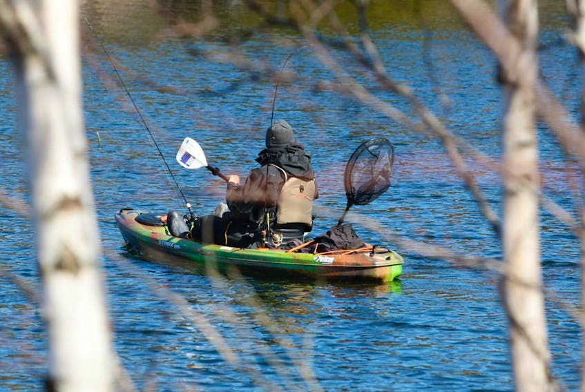 
A fisherman in a kayak spends time trying to get a nibble on Lake Banook on Wednesday. The lack of snow this winter doesn’t concern angler Larry Shortt, who works at Fishing Fever Fly and Tackle Shop. Eric Wynne THE CHRONICLE HERALD
