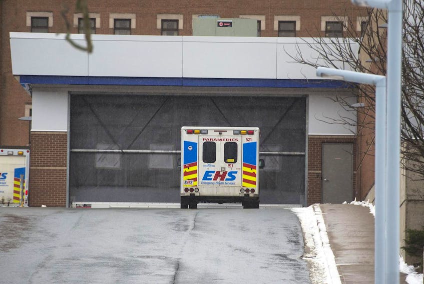 
An ambulance is parked outside the Halifax Infirmary in January. A paramedics union representative told MLAs on Thursday that 30 additional ambulances and more than 200 paramedics are needed. - File
