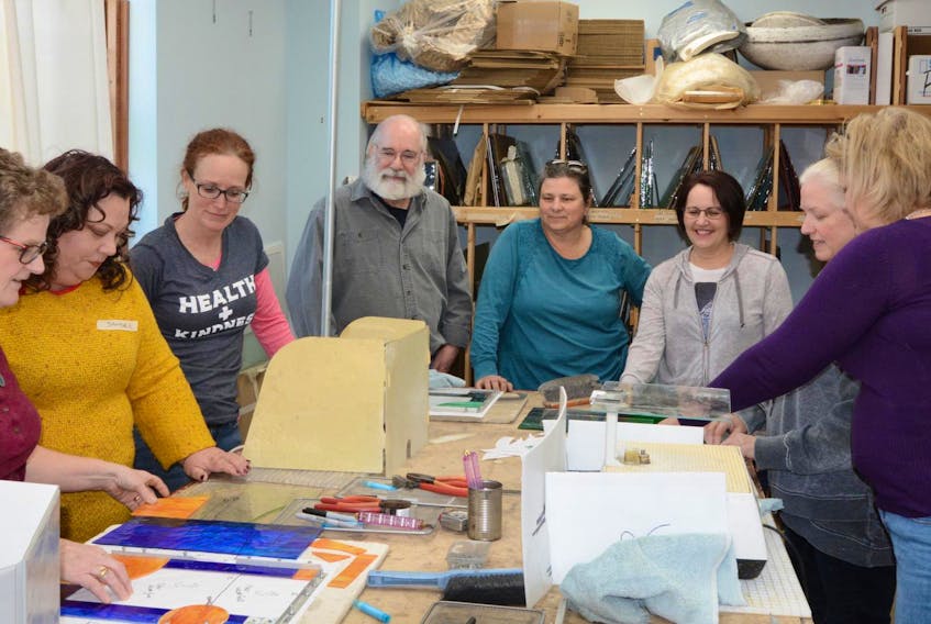 
Students gather around the work table at Cranberry Stained Glass Studio and Supply in Halifax. From left: instructor Suzanne Gould, Sandee MacDonald, Tanya Chisholm, Andy McVicker, owner Lori Nason, Nicole Deveau, Cathy Buik and Jennifer McVeigh.

