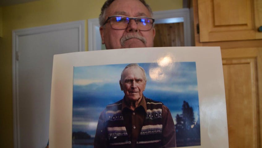 
David Blankenship holds a photo of his father, famed Oak Island treasure hunter Daniel Blankenship. - Aaron Beswick


