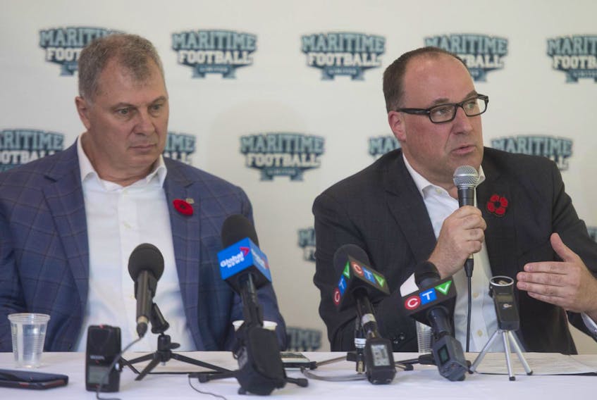 Maritime Football Limited founding partner Anthony LeBlanc, right, answers questions from reporters during a news conference at Saint Mary’s University in February as CFL commissioner Randy Ambrosie listens.