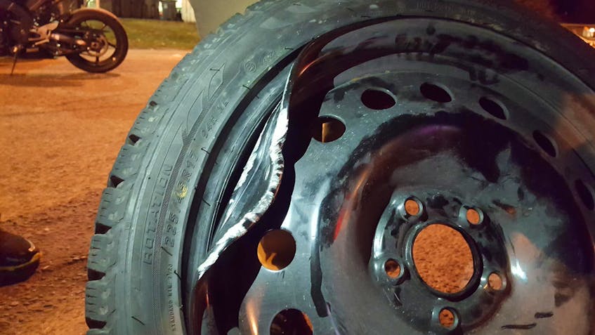 
A damaged wheel caused by driving over a pothole. - Justin Pritchard
