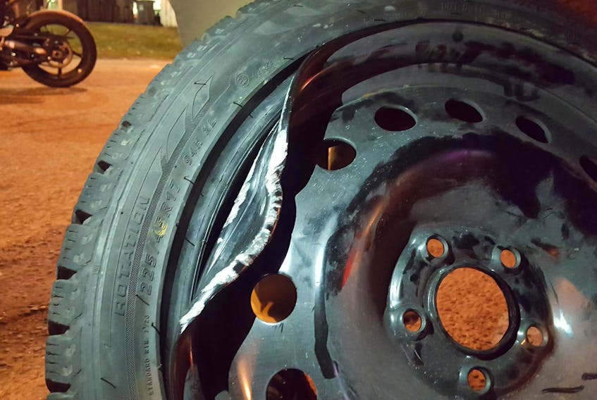 
A damaged wheel caused by driving over a pothole. - Justin Pritchard

