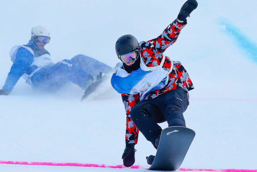 
Liam Moffatt, Truro, crosses the finish line to win bronze in Snowboard Cross at Tabor Mountain, Prince George, B.C., at the 2015 Canada Winter Games. - Communications Nova Scotia/Len Wagg

