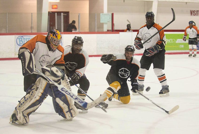
Members of the Black Ice Hockey and Sports Hall of Fame Society play in a hockey game in Cole Harbour in this file photo from February 20, 2015. A new documentary examines the history of black hockey players in Nova Scotia. - File
