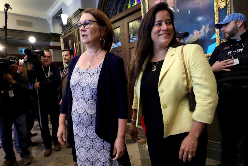  Former ministers Jane Philpott and Jody Wilson-Raybould arrive to speak to journalists in Ottawa on Wednesday.