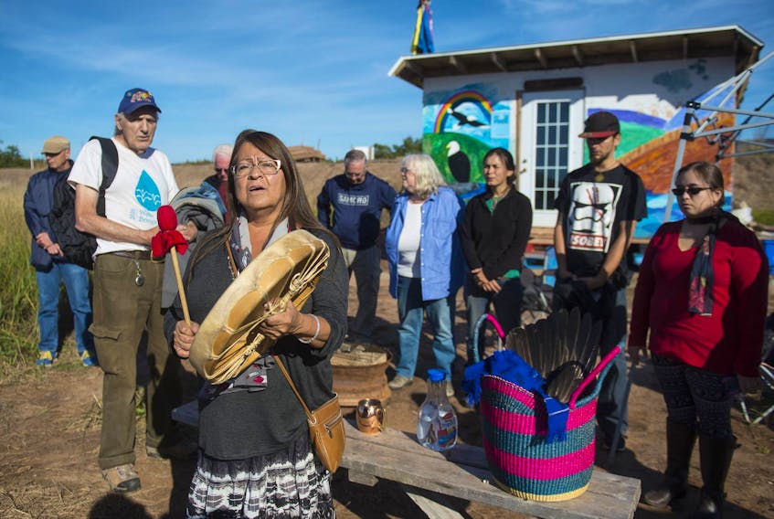 Dorene Bernard, a member of the Sipekne’katik First Nation, drums following a water ceremony along the banks of the Shubenacadie River estuary near the Treaty Truck House in Fort Ellis, Colchester County, last year. Maude Barlow, Honourary Chairperson of the Council of Canadians, joined Bernard and other opponents of the Alton Gas project at the site. - Ryan Taplin